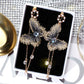 Dark grey and gold furry butterfly earrings