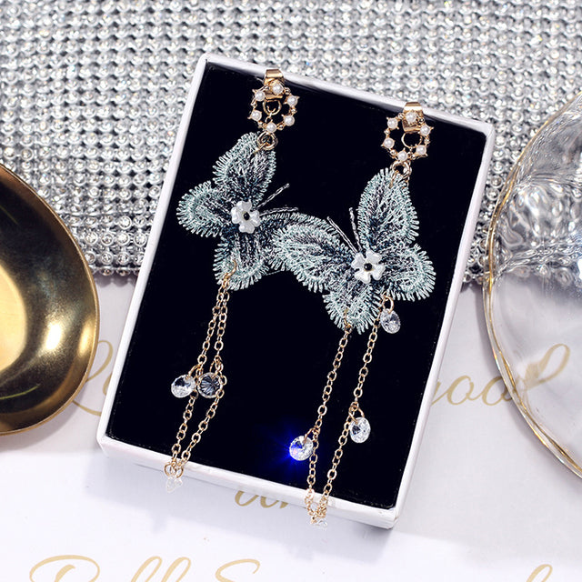 Blue furry butterfly earrings